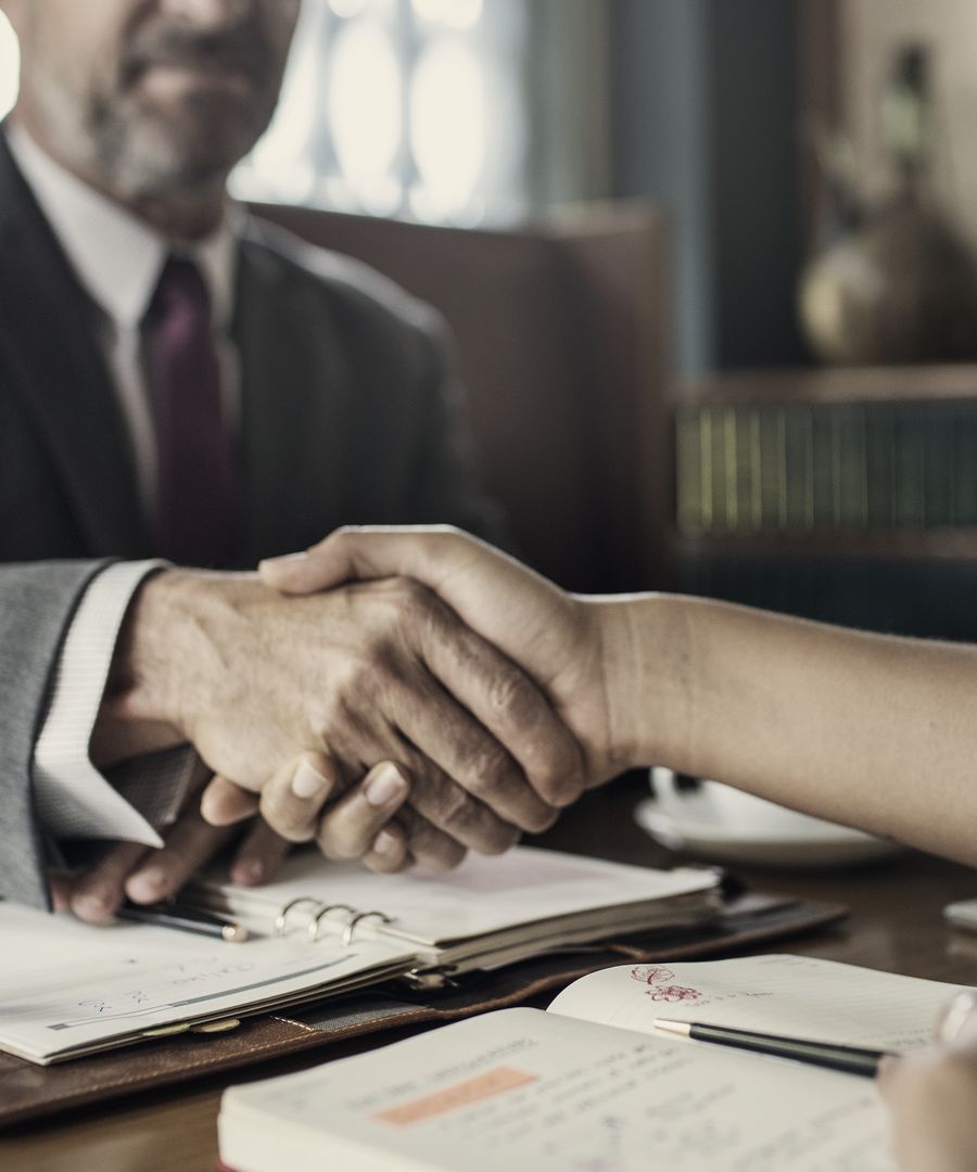Attorney meeting with a client at Guster Law Firm