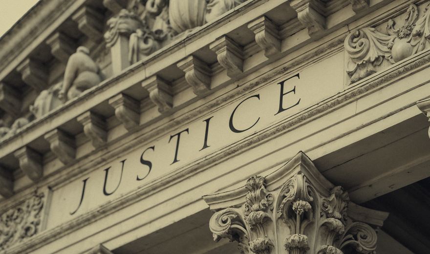 Courthouse facade inscribed Justice